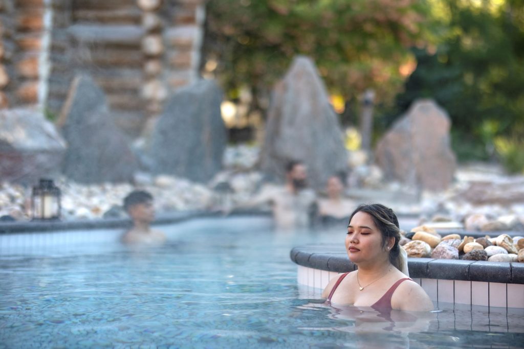 woman enjoying a moment of silence in the thermal bath